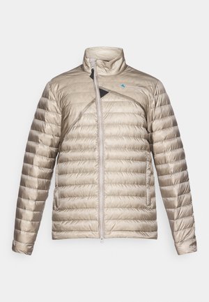 Lightweight padded jacket in beige with a high collar, front zipper, and diagonal black accent. Textured fabric with horizontal quilted pattern.