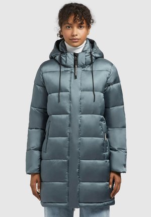 Padded parka in teal with a glossy finish, adjustable hood, front zipper, and side pockets; features a boxy shape and quilted design.