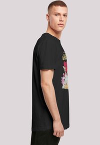 Black cotton t-shirt featuring a colorful graphic print depicting characters and text, crew neck, short sleeves, relaxed fit.