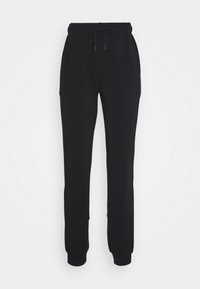 Zwarte trainingsbroek met een elastische tailleband en trekkoord. Beschikt over twee zijzakken en taps toelopende boorden bij de enkels. Glad textuur.