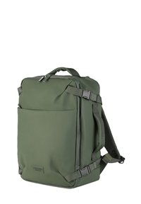 Zaino rettangolare verde con maniglia superiore, spallacci imbottiti regolabili, clip laterali e tasca frontale con cerniera.