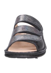 Black metallic sandal with three adjustable straps, open toe design, textured upper, and cushioned footbed. Flexible rubber sole.
