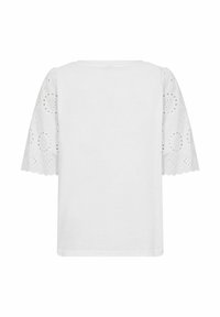 Vit t-shirt med kort ärm som har broderade spetsärmar med cirkulära utskärningar och vågiga kanter, tillverkad av ett mjukt och lätt tyg.