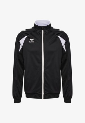 Zwarte sportjas met witte rits, witte schouderaccenten en hummel-logo op de linkerborst, weergegeven op een witte achtergrond.