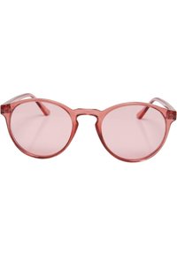Occhiali da sole rotondi con montatura traslucida rosa e lenti abbinate. Design unico del ponte che collega le lenti. Astine sottili con decorazioni minime.