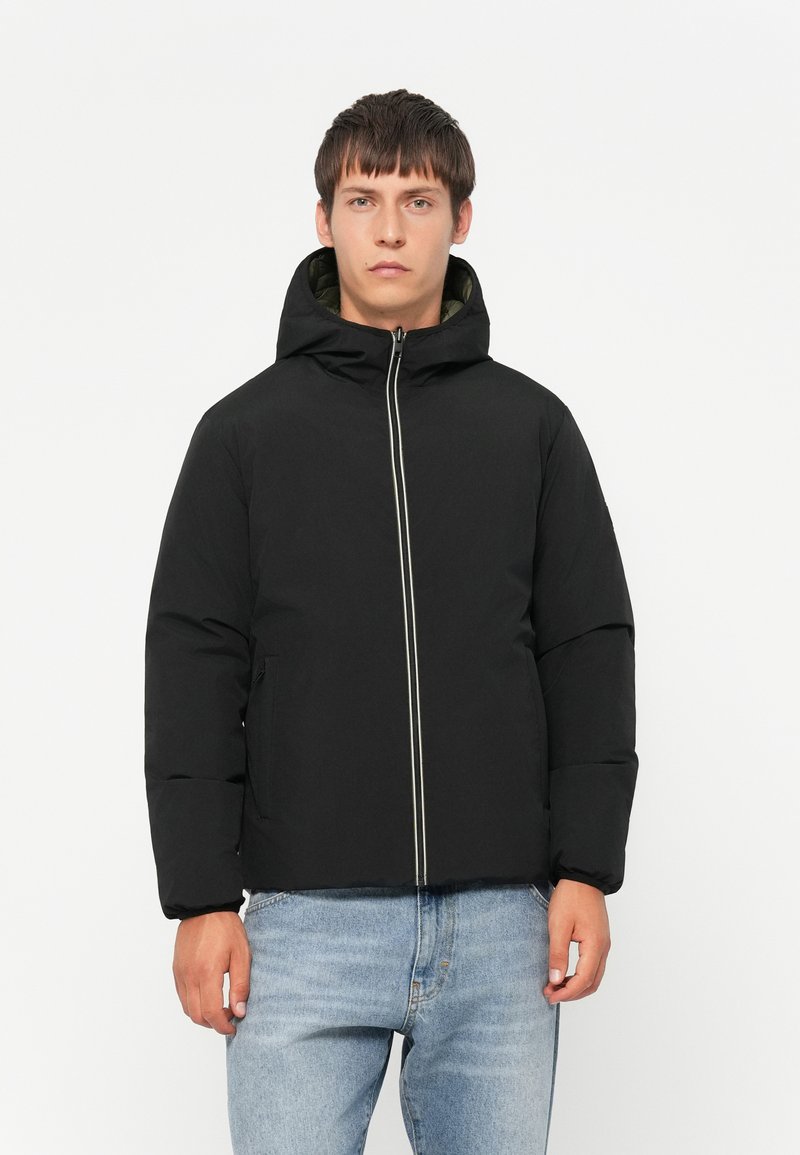 Black padded jacket with a hood, featuring a central zipper and contrasting white piping. Smooth texture and minimalist design.