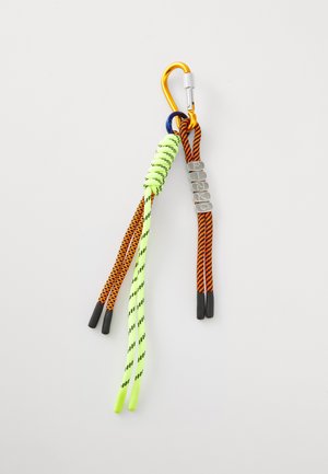 Keychain with neon green and orange patterned cords, a metal carabiner, and silver letters spelling "PINKO." Textured and multi-colored design.