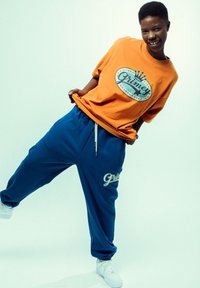 Grimey CAMISETA  MADRI HEAVYWEIGHT - Camiseta estampada - naranja