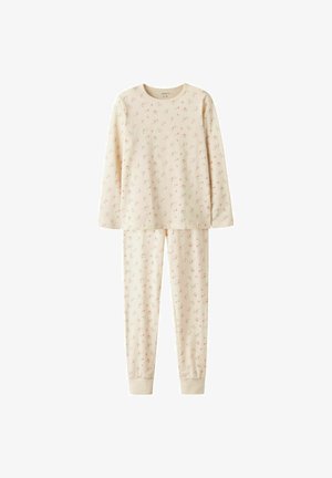 Haut à manches longues crème et pantalon assorti avec un délicat motif floral rose. Fabriqué en tissu doux avec des poignets côtelés aux chevilles.