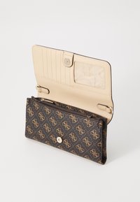 Brown patterned wallet with gold logo design, a cream interior, multiple card slots, a transparent ID window, and a zippered compartment.