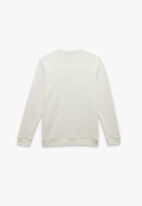 Felpa a maniche lunghe di un leggero beige, con un motivo a nido d'ape testurizzato. Presenta un collo a giro e polsini e orlo a costine.