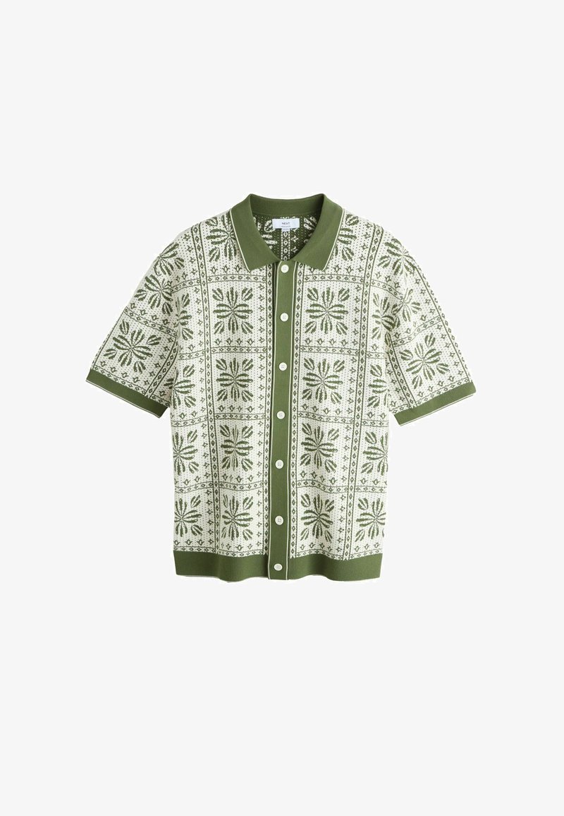 Koszula z krótkim rękawem w kolorze zielonym i białym, z kwiatowym wzorem, dzianą fakturą oraz zapinana na guziki z kontrastującym kołnierzykiem.