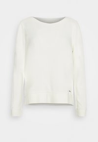 Bílá dlouhá mikina s dlouhým rukávem vyrobená z měkké tkaniny. Disponuje kulatým výstřihem, volným střihem a malým vyšitým logem poblíž spodního lemování.