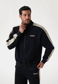 Guess KONTRASTSTREIFEN - Tröja med dragkedja - schwarz