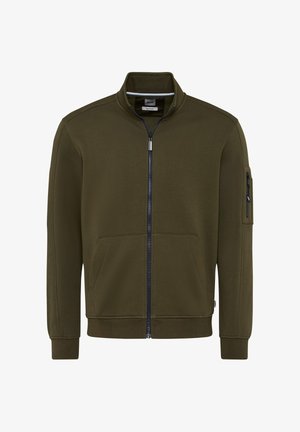 Giacca a zip verde oliva realizzata in misto cotone, con maniche lunghe, tasche laterali e una tasca con zip sulla manica. Texture liscia e design minimale.