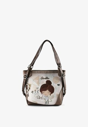 Braune und beige Handtasche mit langen Trägern, versehen mit einer Cartoon-Mädchen-Illustration und dem Text "In love with knowledge" auf der Vorderseite.