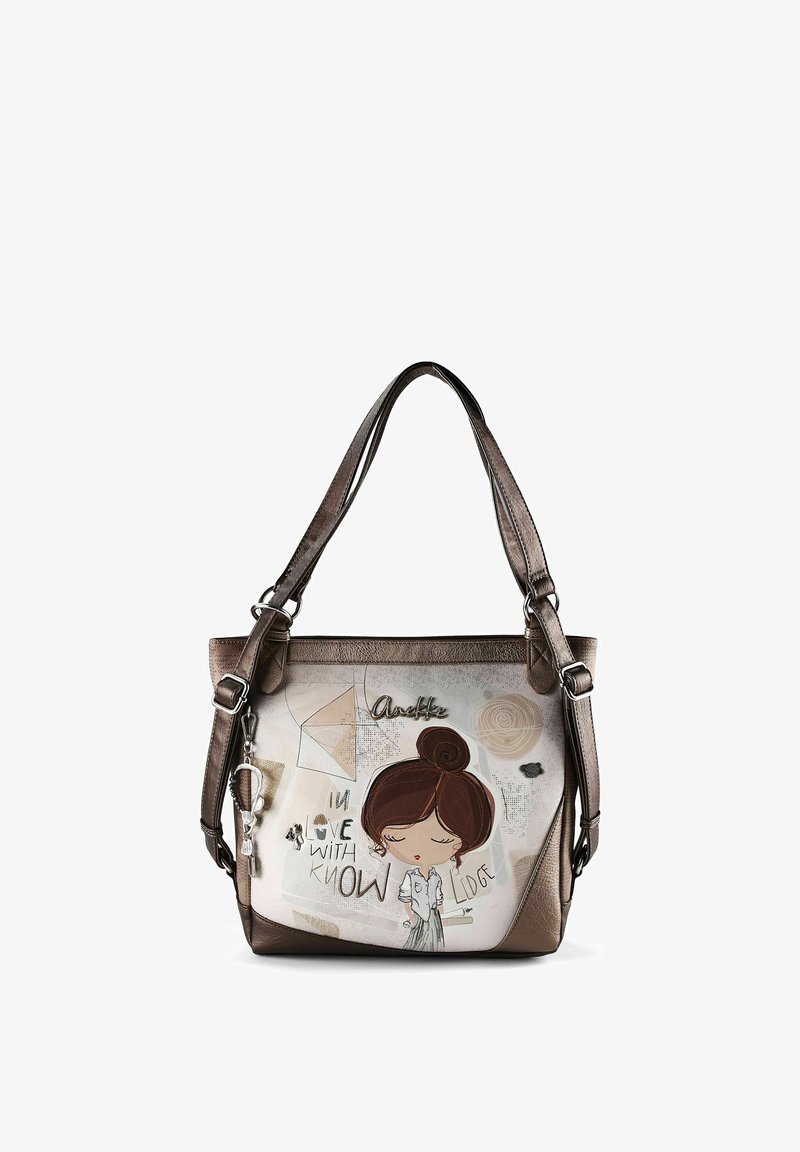 Bolso marrón y beige con correas largas, con una ilustración de una niña de dibujos animados y el texto "Enamorada del conocimiento" en el panel frontal.