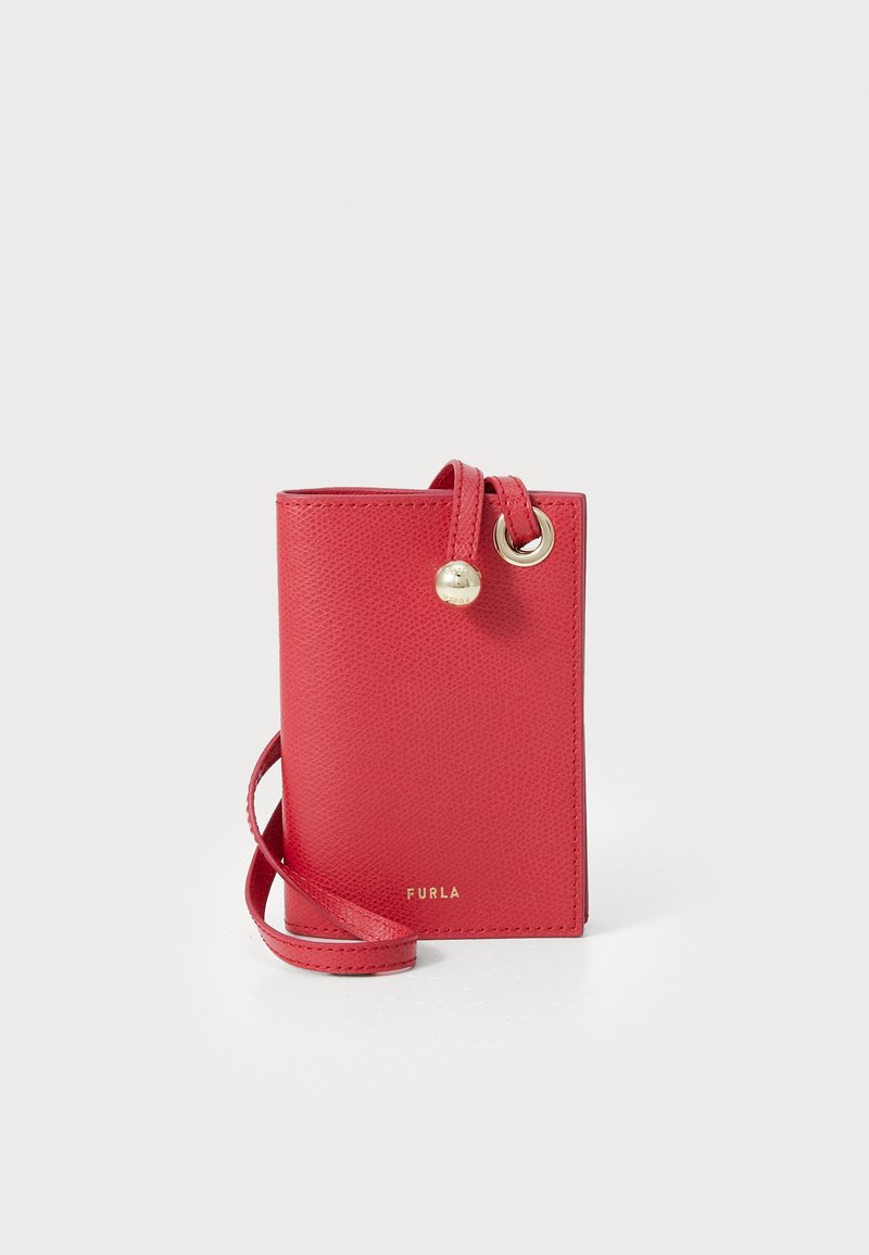 Red leather cardholder with a textured finish, featuring a gold hardware ring and drawstring. Front displays embossed brand name "Furla."