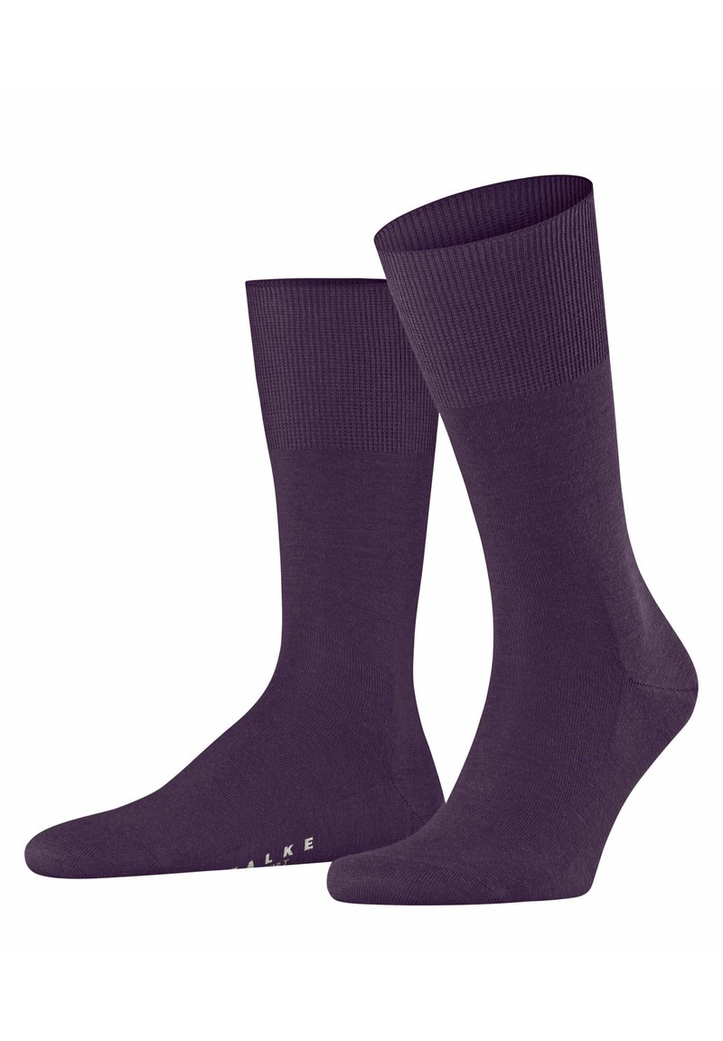 Calzini in cotone di colore viola scuro con polsini a coste e texture liscia. Presentano una punta rinforzata e un dettaglio con logo sulla suola.