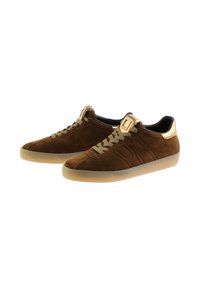 Brown suede sneakers with beige laces, translucent rubber soles, and gold metallic details on heels and tongue tabs.