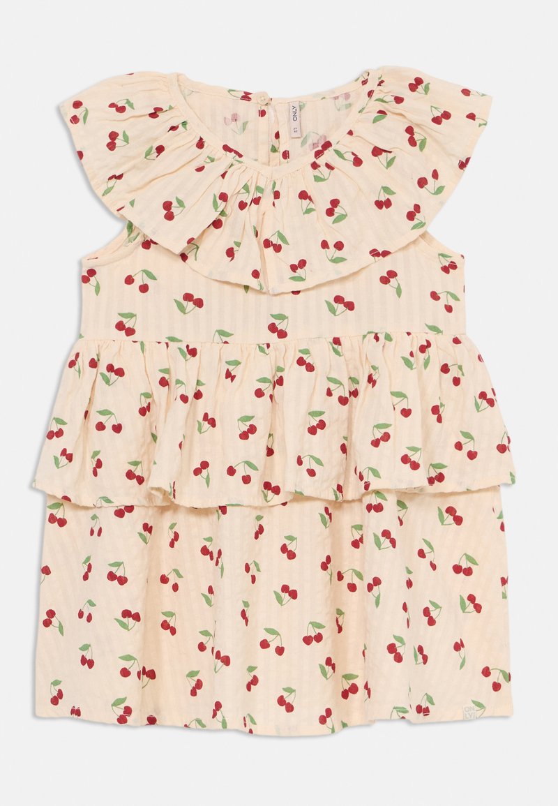 Lys beige kjole med volanger på ermene og lagdelt design, prydet med kirsebærtrykk i rødt og grønt. Laget av myk, lett stoff.