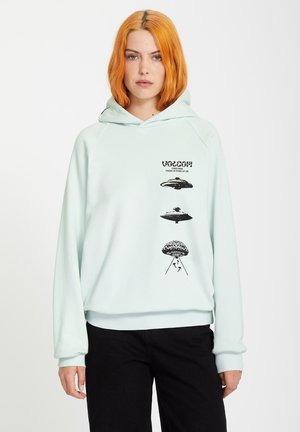 Hoodie vert menthe à la coupe décontractée, avec des graphismes de soucoupes volantes noires et du texte sur le devant. Fabriqué en matériau doux avec des poignets côtelés.