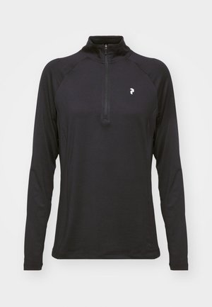 Crna dugosleeve majica s četvrtim patentnim zatvaračem, glatke teksture i uskog kroja. Ima raglan rukave i mali bijeli logo na prsima.