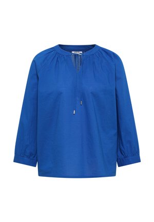 Blouse bleu vif à manches longues avec encolure froncée, ouverture goutte d'eau et cordon avec embouts métalliques, coupe ample et poignets élastiqués.