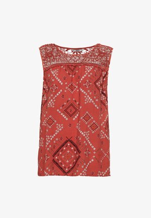 Red patterned sleeveless top with a lace yoke. Features geometric designs in white and black. Soft fabric, loose fit, and rounded neckline.