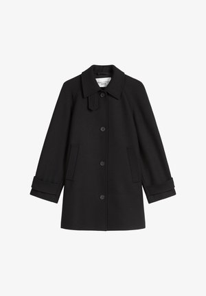 Zwart wollen jas met een kraag, sluiting met knopen aan de voorkant en zijzakken. Voorzien van opgerolde mouwen en een rechte silhout.