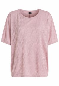 Vaaleanpunainen lyhythihainen pusero, jossa on hienovarainen vinonauhakaistaleinen pitsikuvio ja pyöreä pääntie, hartiassa merkintä "protest".