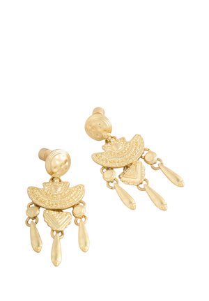 Gold-toned earrings featuring circular and crescent shapes, intricate patterns, and dangling accents with elongated drops.