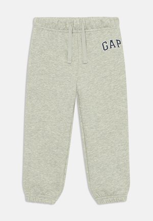 Lysegrå joggebukser laget av en bomullsblanding, med elastisk midje, snor og ribbestrikkede mansjetter, med "GAP"-logo i marineblå.