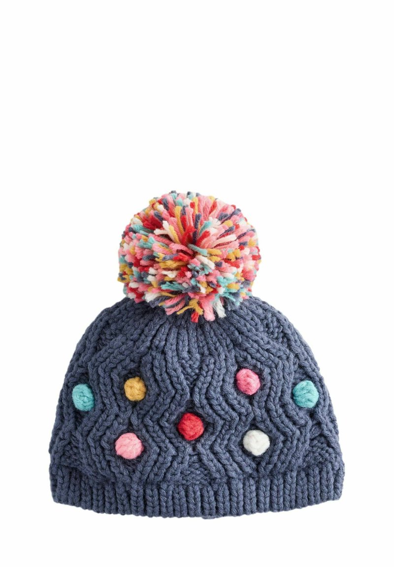 Gehaakte marineblauwe muts met een kleurrijke pompon bovenop, met een zigzagstructuur en stippen in roze, rood, blauw, geel en wit.