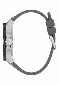 Orologio grigio con un quadrante testurizzato e una lunetta verde scuro, cassa in acciaio inox argentato e un cinturino grigio flessibile. Presenta una corona prominente sul lato.