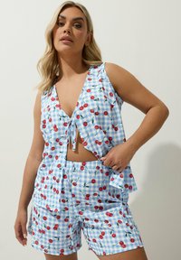 Blue gingham sleep set with red cherry print; features a sleeveless top with a V-neck and shorts with an elastic waistband.