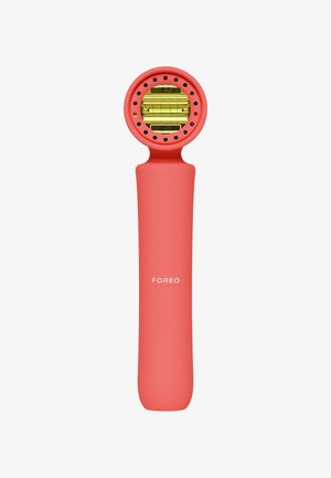 Korallenrosa tragbares Gesichtsgerät mit einem runden Kopf, goldenen Akzenten und durchlöchertem Surface, ausgestattet mit einem glatten, ergonomischen Griff.