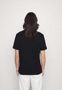 Volcom MAX LOEFFLER  - T-shirt estampada - black