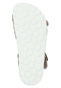 Tan sandal sole with a textured white rubber bottom featuring circular patterns; side strap with adjustable buckle for fit.