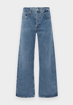 Wide-leg, blue denim jeans with a classic five-pocket design, button closure, and faded texture, featuring raw edge hems.