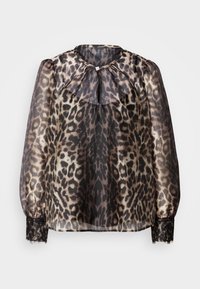 Blouse en dentelle léopard translucide avec un col montant, un détail froncé à l'avant et des accents en dentelle noire au niveau des poignets.