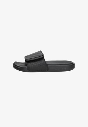 Black slide sandal with a textured, adjustable strap, cushioned sole, and a smooth finish. Designed for casual wear and comfort.