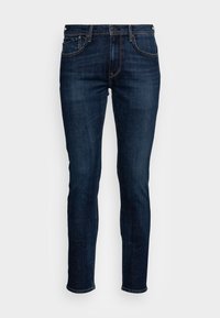 Dark blue denim jeans with a slim fit, featuring front pockets, a zip fly, and a classic five-pocket design. Even texture with faint fading.