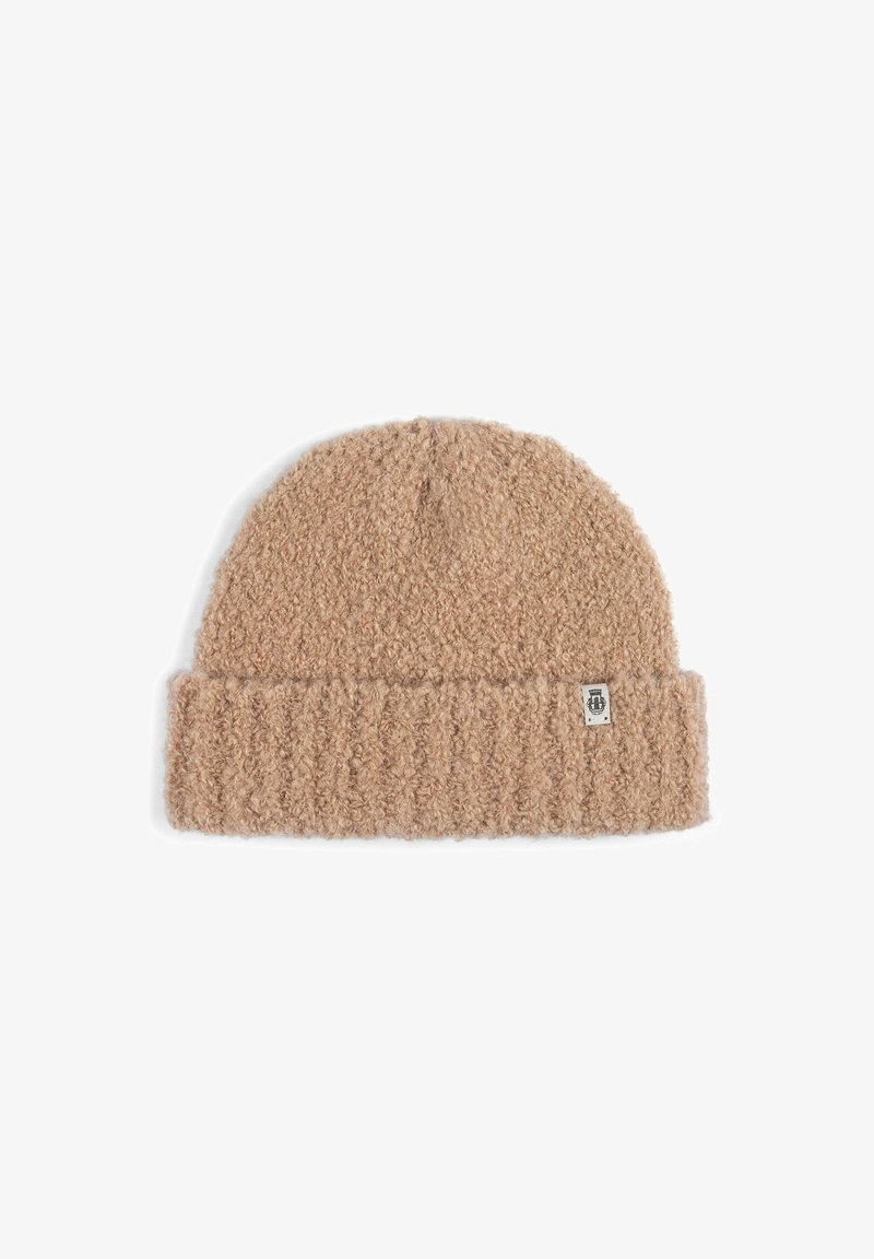 Brown textured knit beanie with ribbed fold-over cuff and small rectangular label on the cuff’s side.