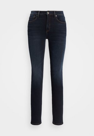 Mørkeblå slim-fit jeans med fem lommer, knap- og lynlås-lukning samt orange syninger.
