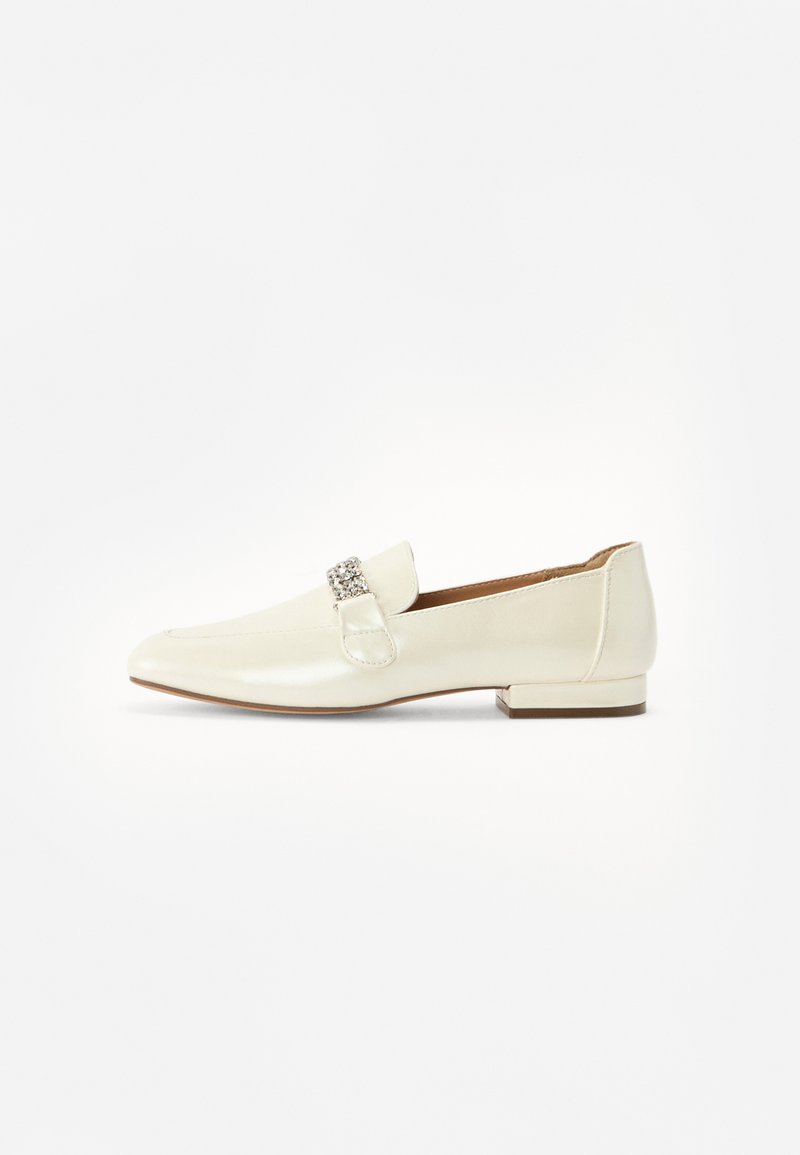 White leather loafer with a low block heel, featuring a decorative metallic buckle on the front and smooth, glossy texture.