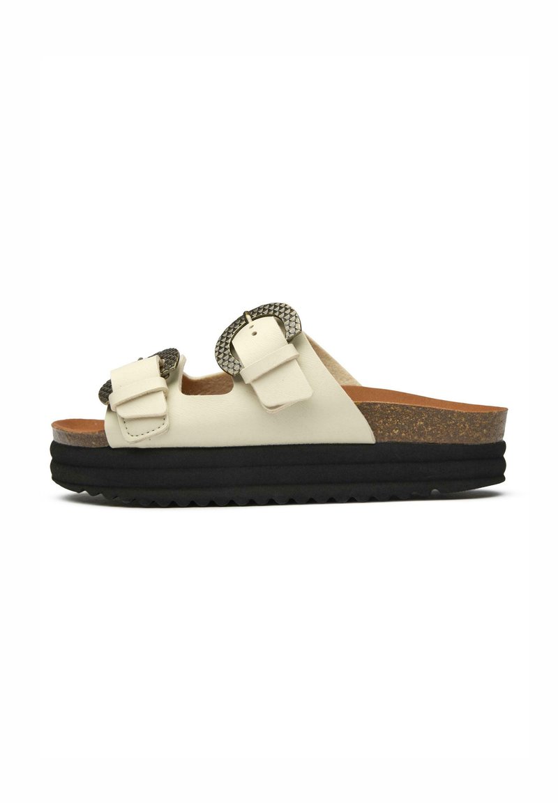 White leather slide sandal with two textured gray buckles, cork midsole, and black rubber outsole featuring a zigzag pattern.