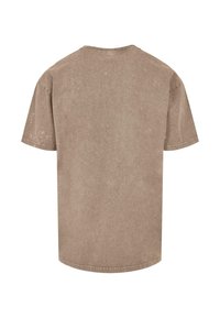 Cotton t-shirt, short sleeves, in a muted taupe color with a subtle texture, featuring a crew neck and a relaxed fit.