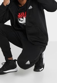 adidas Performance Teplákové kalhoty - black