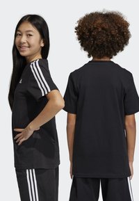 adidas Performance TEE - Camiseta estampada - black/white
